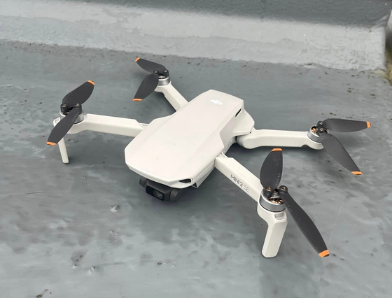 white-folded-drone-on-ground